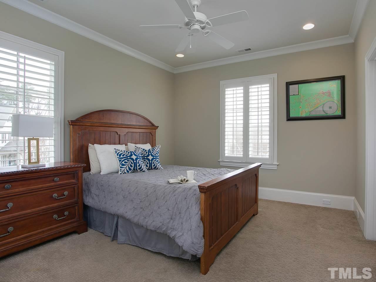 507 Guilford Circle Raleigh, NC 27608 - Photo 23 of 26 a bedroom with a bed and a dresser