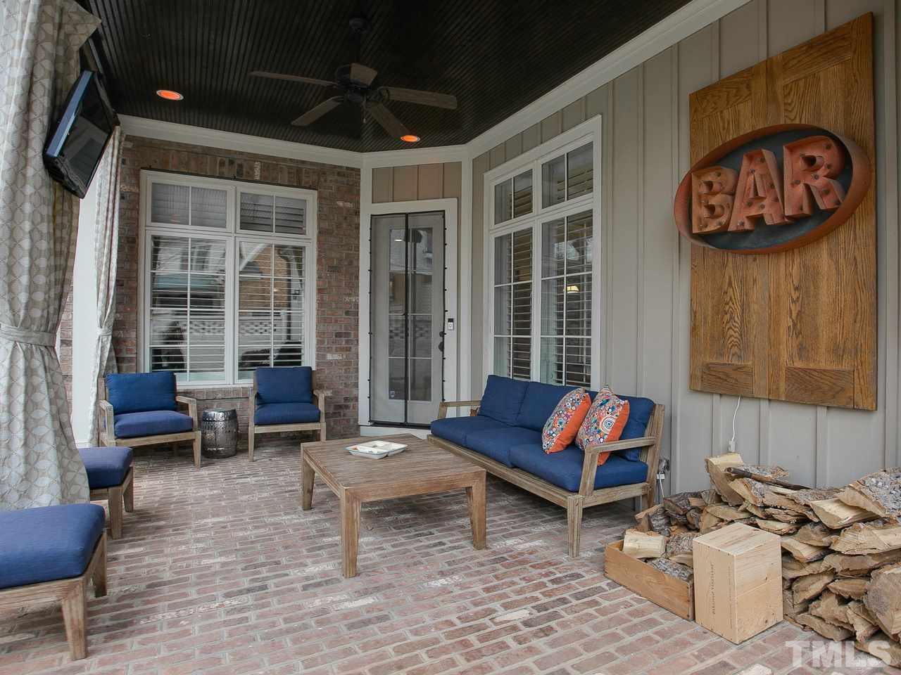 507 Guilford Circle Raleigh, NC 27608 - Photo 25 of 26 a building outdoor space with patio furniture and potted plants