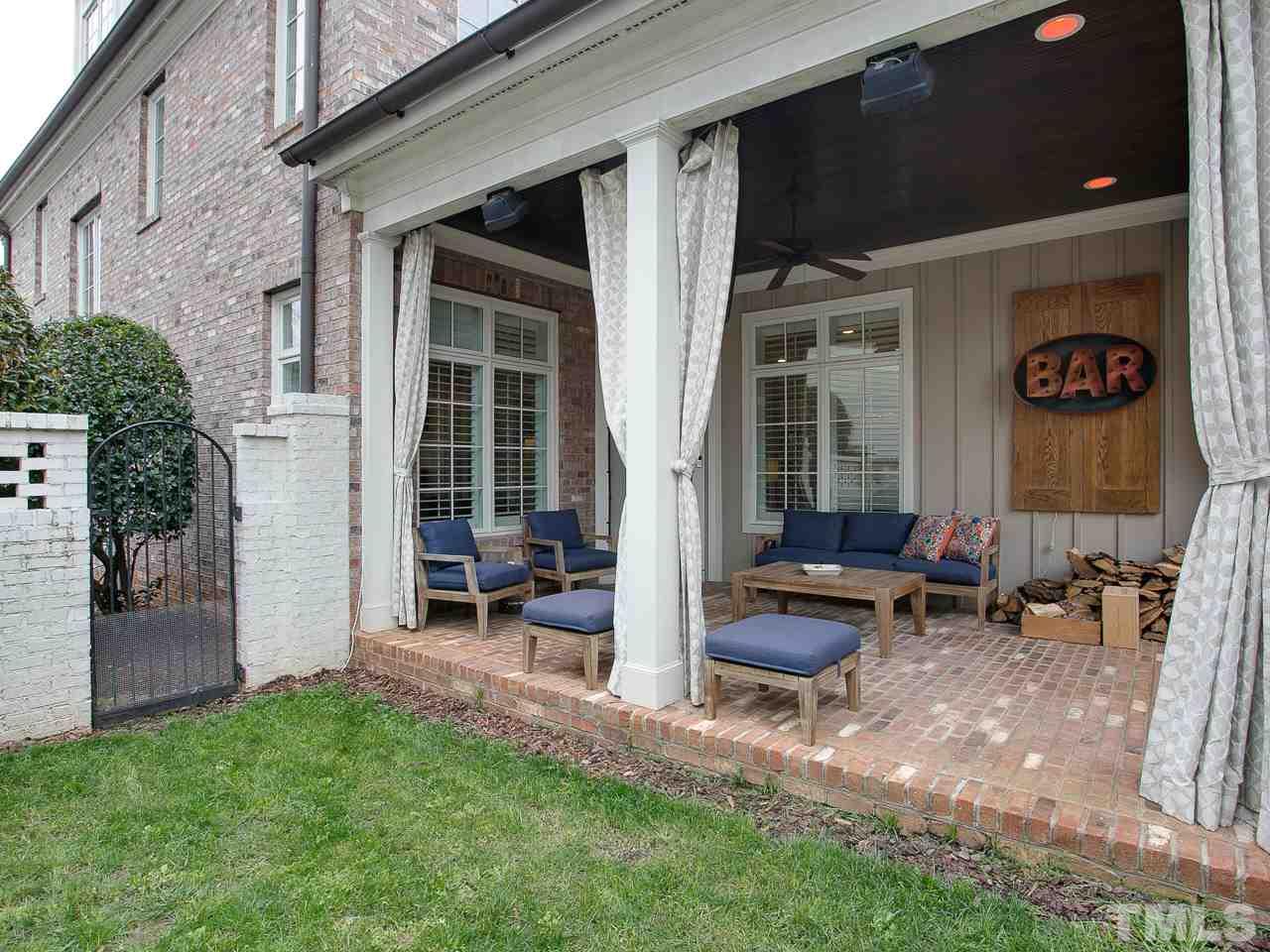 507 Guilford Circle Raleigh, NC 27608 - Photo 26 of 26 a view of a patio with table and chairs and potted plants