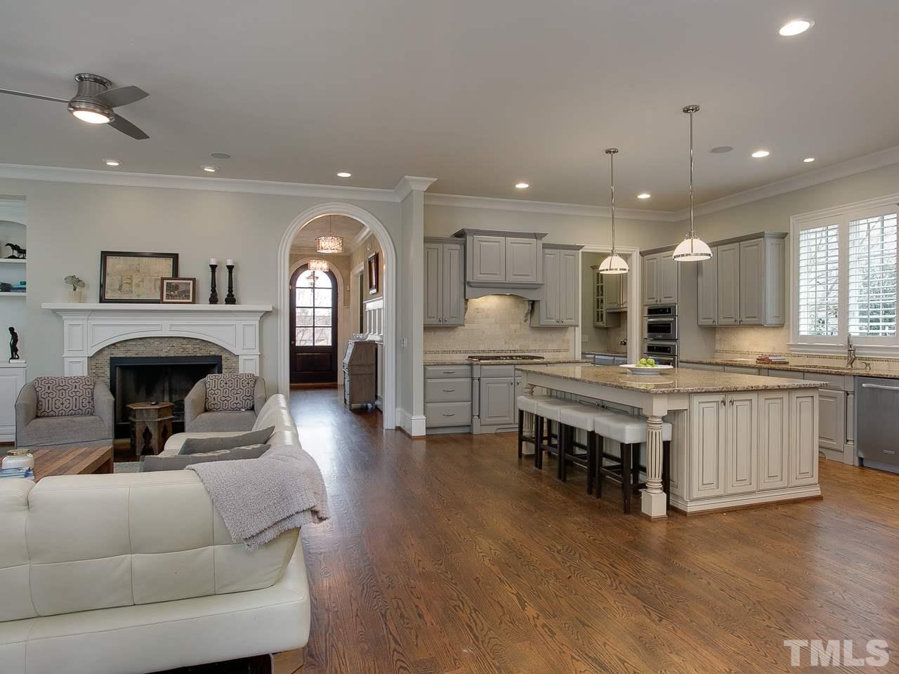 507 Guilford Circle Raleigh, NC 27608 - Photo 5 of 26 a living room with furniture and a fireplace