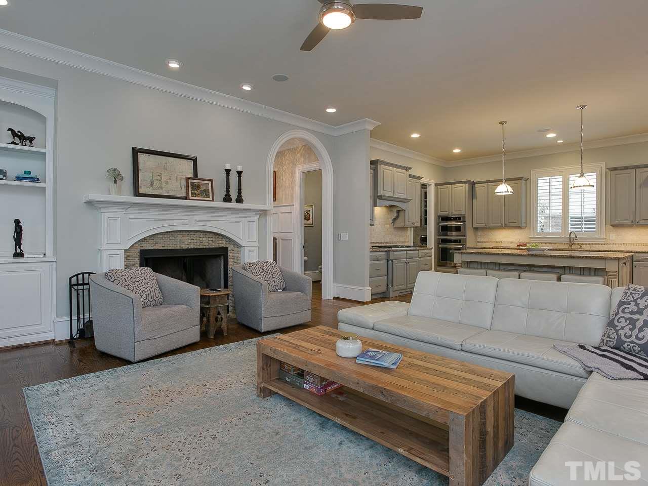 507 Guilford Circle Raleigh, NC 27608 - Photo 8 of 26 a living room with furniture and a fireplace