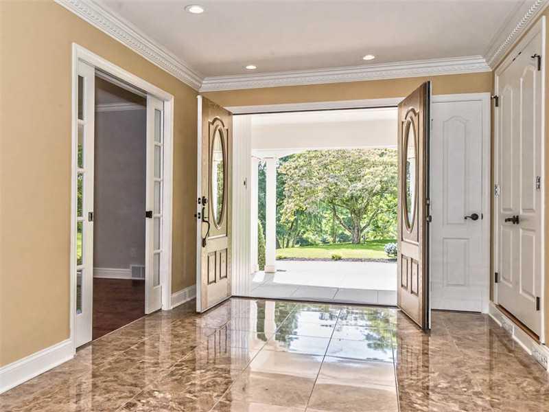 1602 Powers Run Road Fox Chapel, PA 15238 - Photo 3 of 25 Entry/Foyer. Beautiful solid wood and leaded glass double front doors lead into the exquisite formal entry of the home with marble floors, ample coat closets, decorative crown molding, recessed lighting and pocket french doors into the formal dining room.