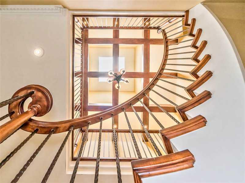 1602 Powers Run Road Fox Chapel, PA 15238 - Photo 6 of 25 Entry/Foyer. Absolutely amazing, custom three story curved wood and iron staircase topped with thick wood beams and a massive skylight.