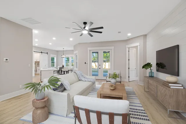 a kitchen with kitchen island a sink appliances and cabinets