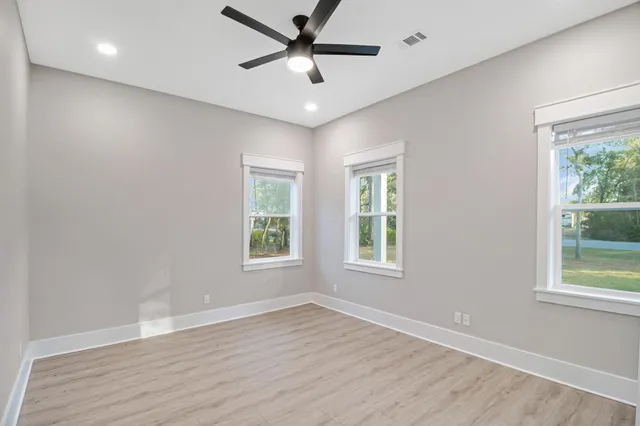 a spacious bathroom with double vanity sink and a mirror