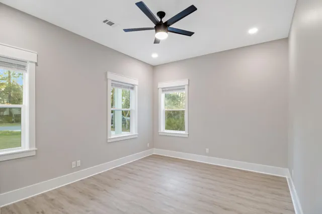 a bathroom with double vanity sinks and a mirror