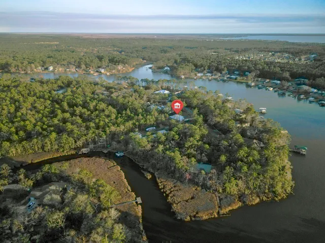 a view of a house with a yard and a garage