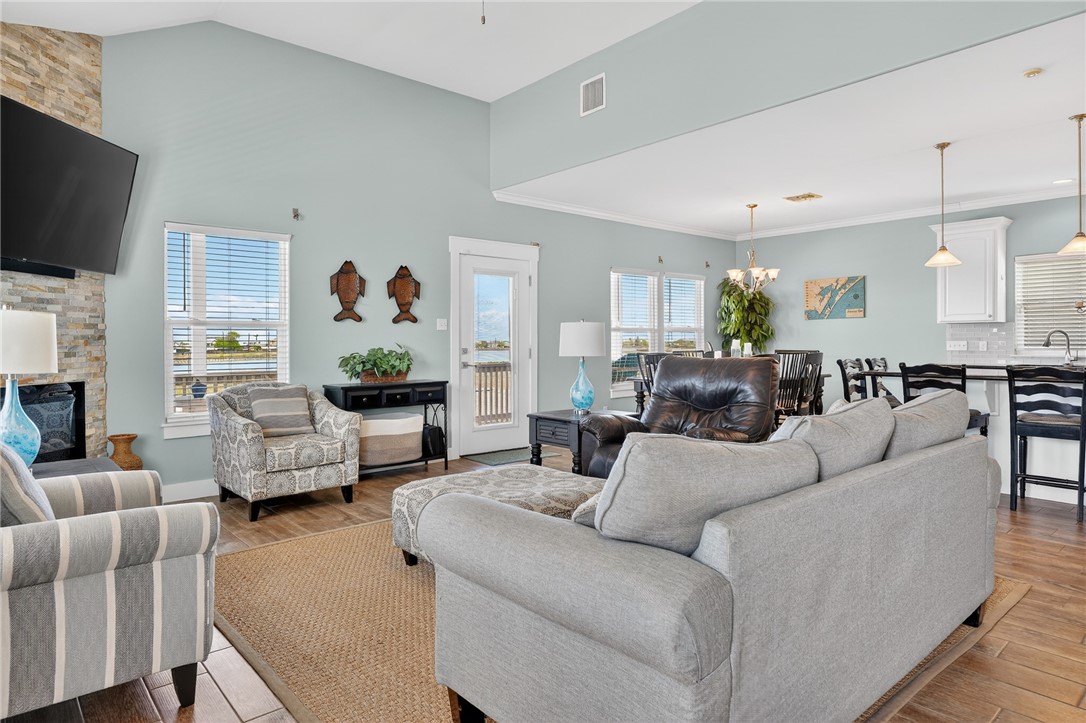 838 Rattlesnake Point Road Rockport, TX 78382 - Photo 10 of 40 a living room with furniture and a flat screen tv