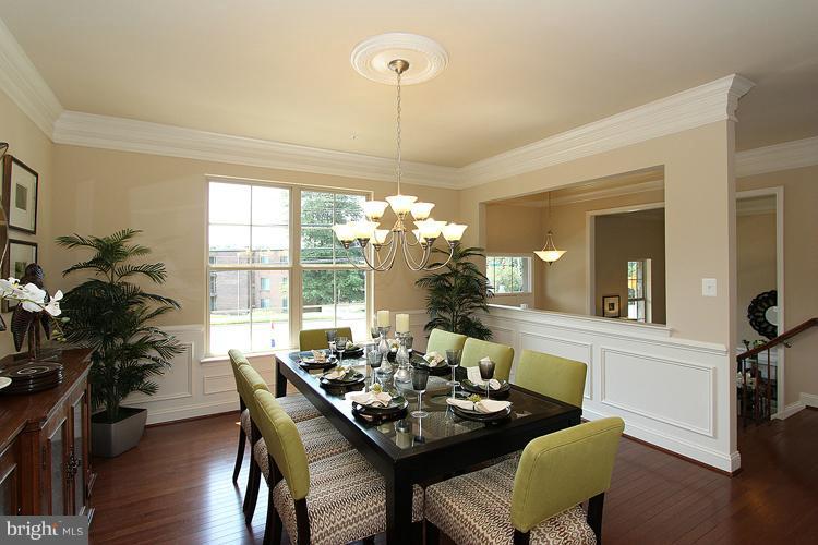 3041 Bel Pre Road Silver Spring, MD 20906 - Photo 14 of 28 a dining room with furniture window wooden floor