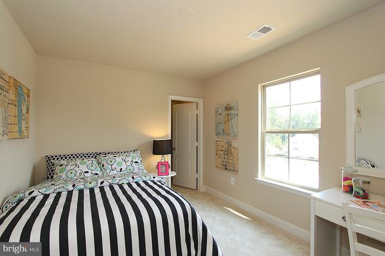 3041 Bel Pre Road Silver Spring, MD 20906 - Photo 22 of 28 a bedroom with a bed and a window