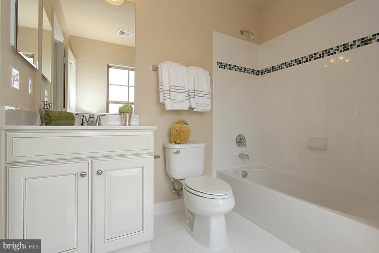 3041 Bel Pre Road Silver Spring, MD 20906 - Photo 23 of 28 a bathroom with a sink a toilet and shower