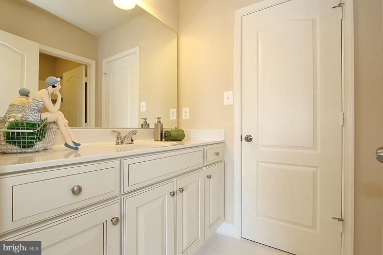 3041 Bel Pre Road Silver Spring, MD 20906 - Photo 25 of 28 a bathroom with a sink and a mirror