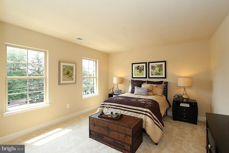 3041 Bel Pre Road Silver Spring, MD 20906 - Photo 26 of 28 a bedroom with a bed and wooden floor