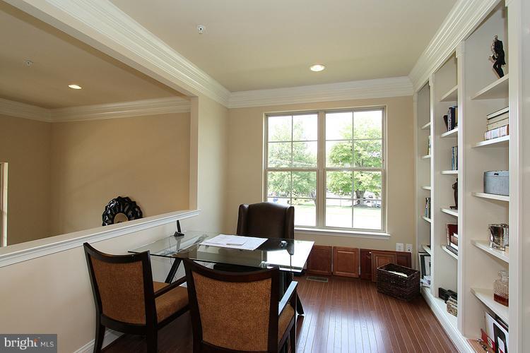 3041 Bel Pre Road Silver Spring, MD 20906 - Photo 7 of 28 a dining room with furniture and wooden floor