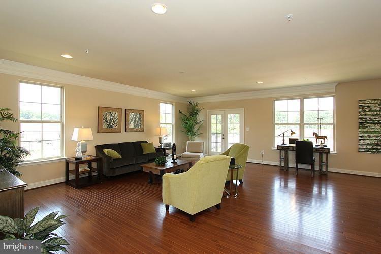 3041 Bel Pre Road Silver Spring, MD 20906 - Photo 9 of 28 a living room with furniture wooden floor and a large window