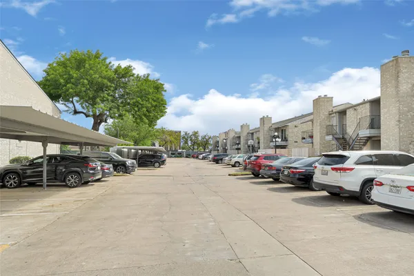 a view of street with parked cars