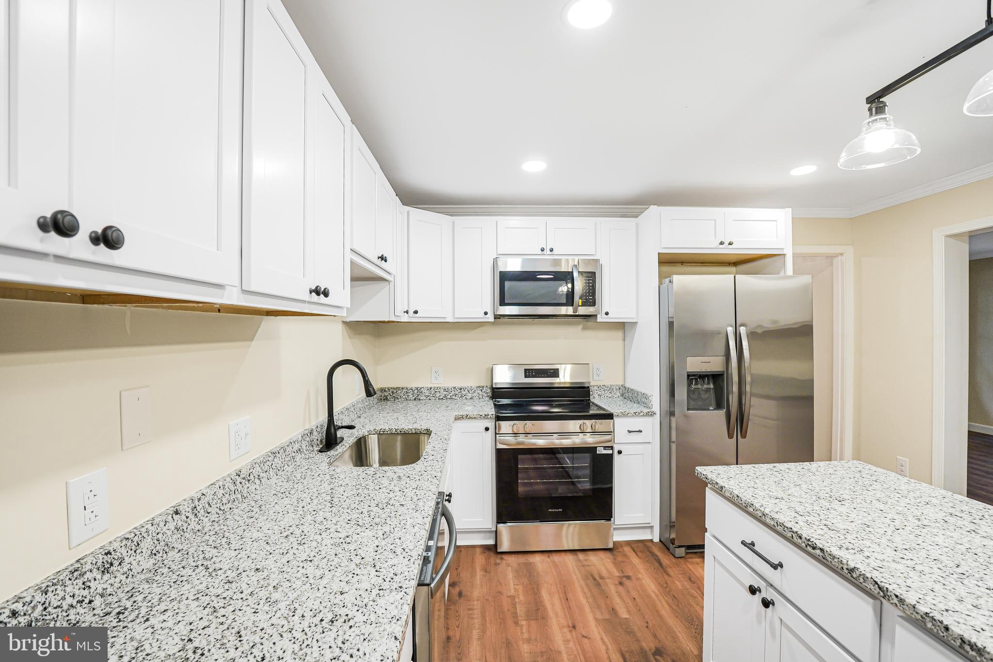 767 Loving Road Zion Crossroads, VA 22942 - Photo 5 of 33 a kitchen with stainless steel appliances granite countertop a stove a sink and a refrigerator