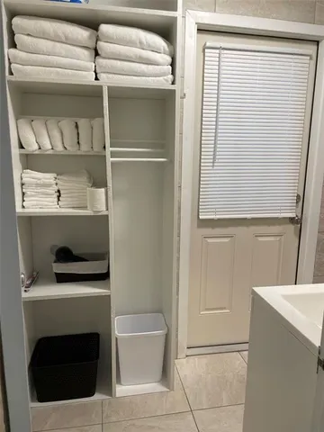 a bathroom with a sink and washing machine