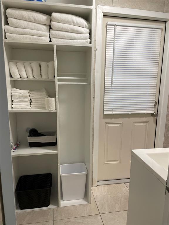 828 South Tuttle Avenue, Unit B Sarasota, FL 34237 - Photo 12 of 63 a bathroom with a sink and washing machine