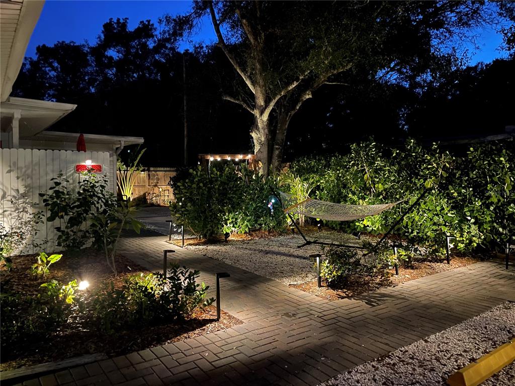 828 South Tuttle Avenue, Unit B Sarasota, FL 34237 - Photo 21 of 63 a view of a patio with table and chairs and potted plants
