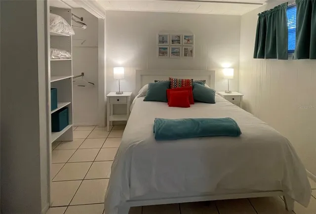 a bedroom with a bed and a cabinets