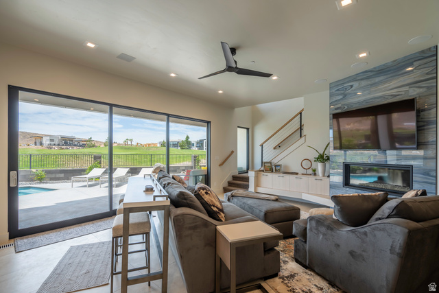 3606 South Cypress Road Hurricane, UT 84737 - Photo 56 of 69 Living room featuring ceiling fan, recessed lighting, and a premium fireplace