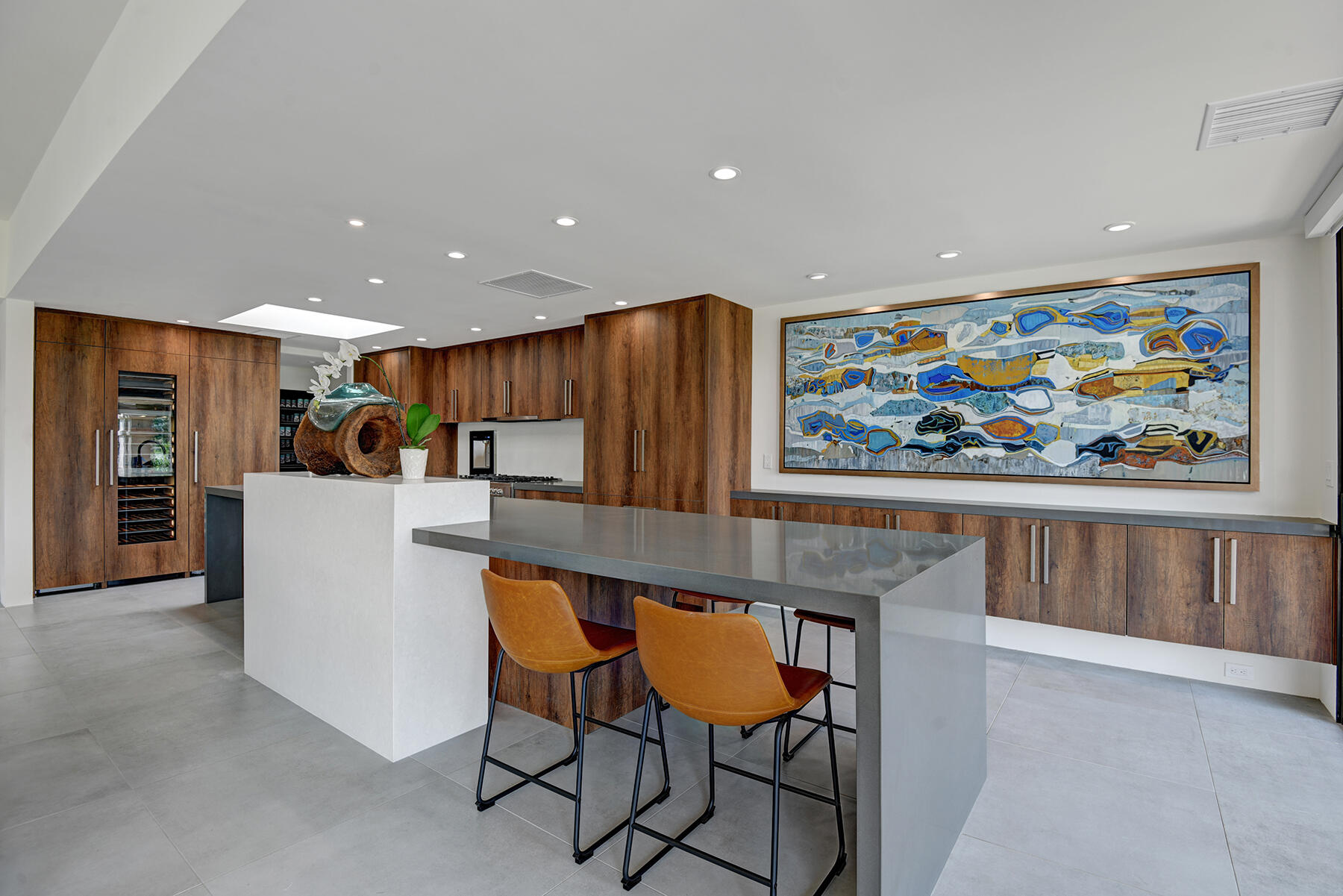 a view of a dining room with furniture and a kitchen