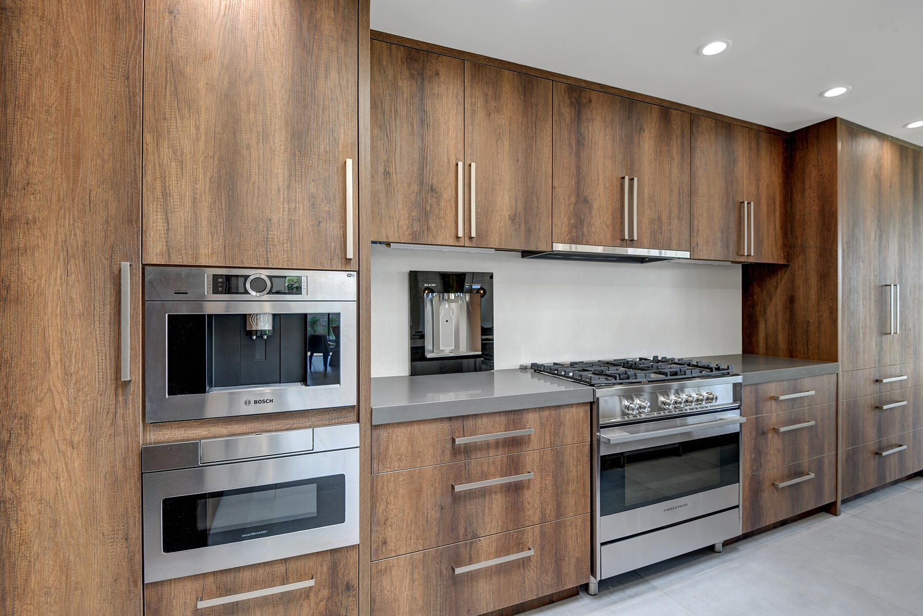 73 Princeton Drive Rancho Mirage, CA 92270 - Photo 13 of 44 a kitchen with granite countertop wooden cabinets and stainless steel appliances