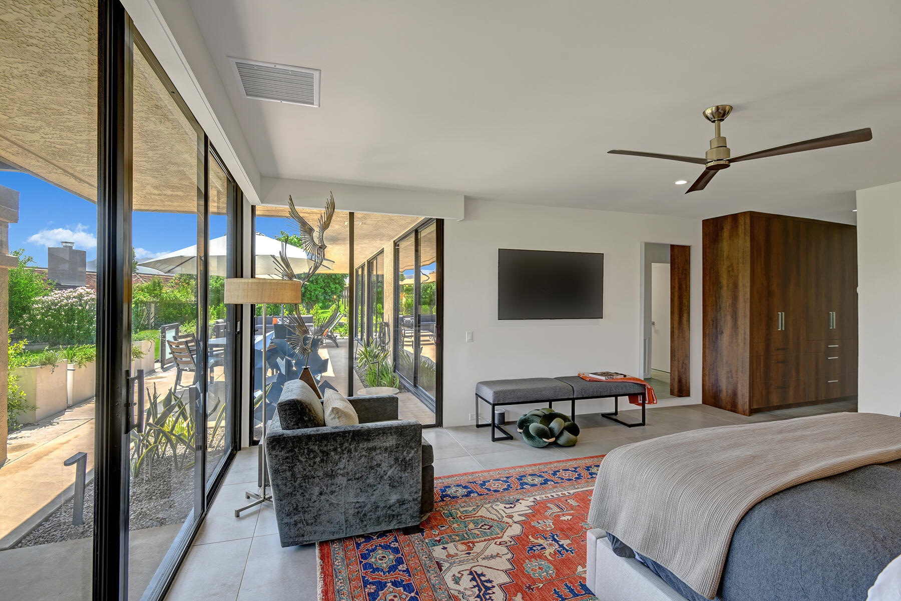 73 Princeton Drive Rancho Mirage, CA 92270 - Photo 21 of 44 a bedroom with a bed and large windows
