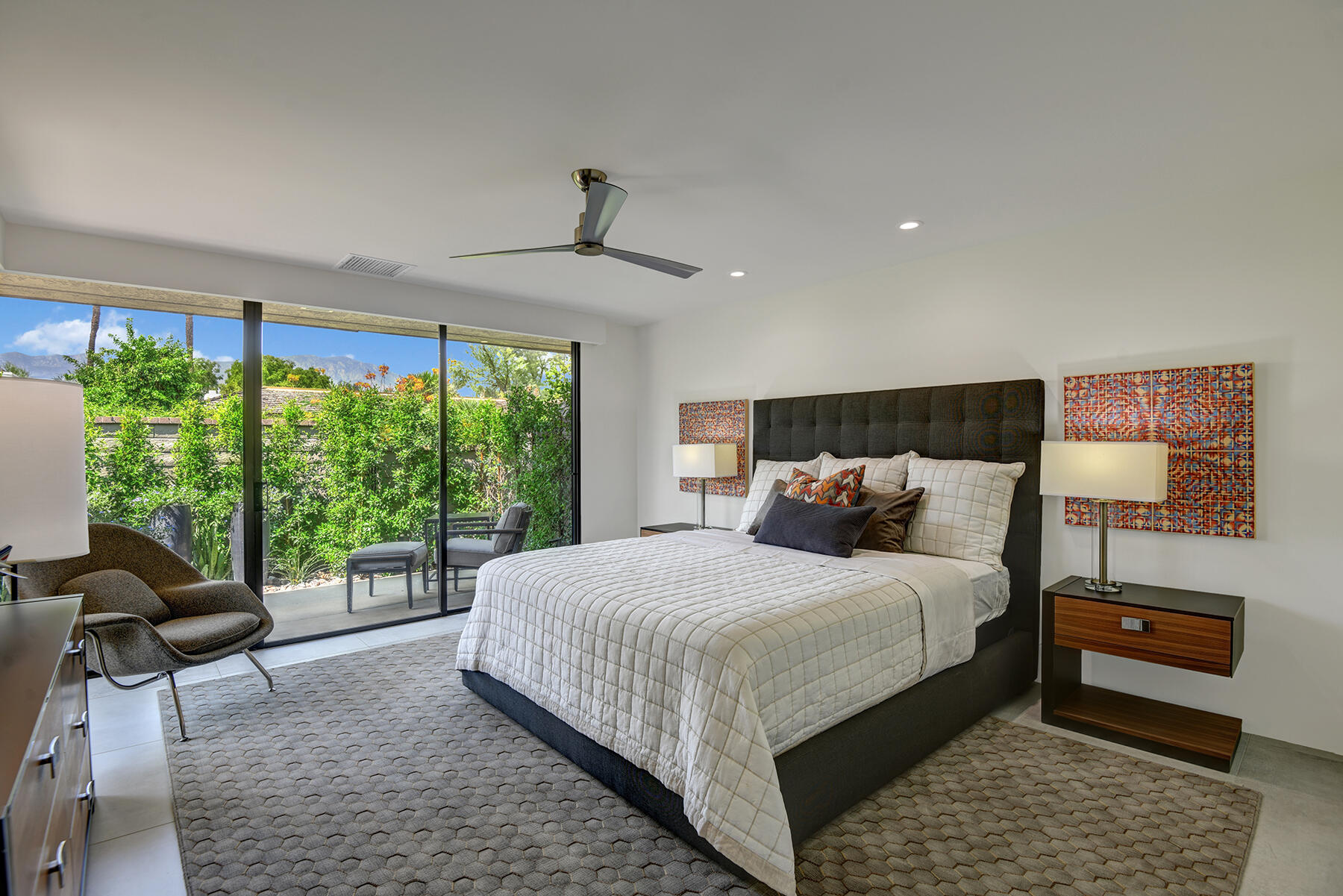 73 Princeton Drive Rancho Mirage, CA 92270 - Photo 27 of 44 a bedroom with a large bed and a window