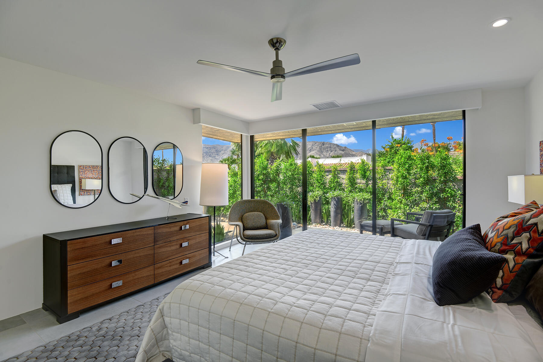 73 Princeton Drive Rancho Mirage, CA 92270 - Photo 28 of 44 a bedroom with a bed a closet and large window
