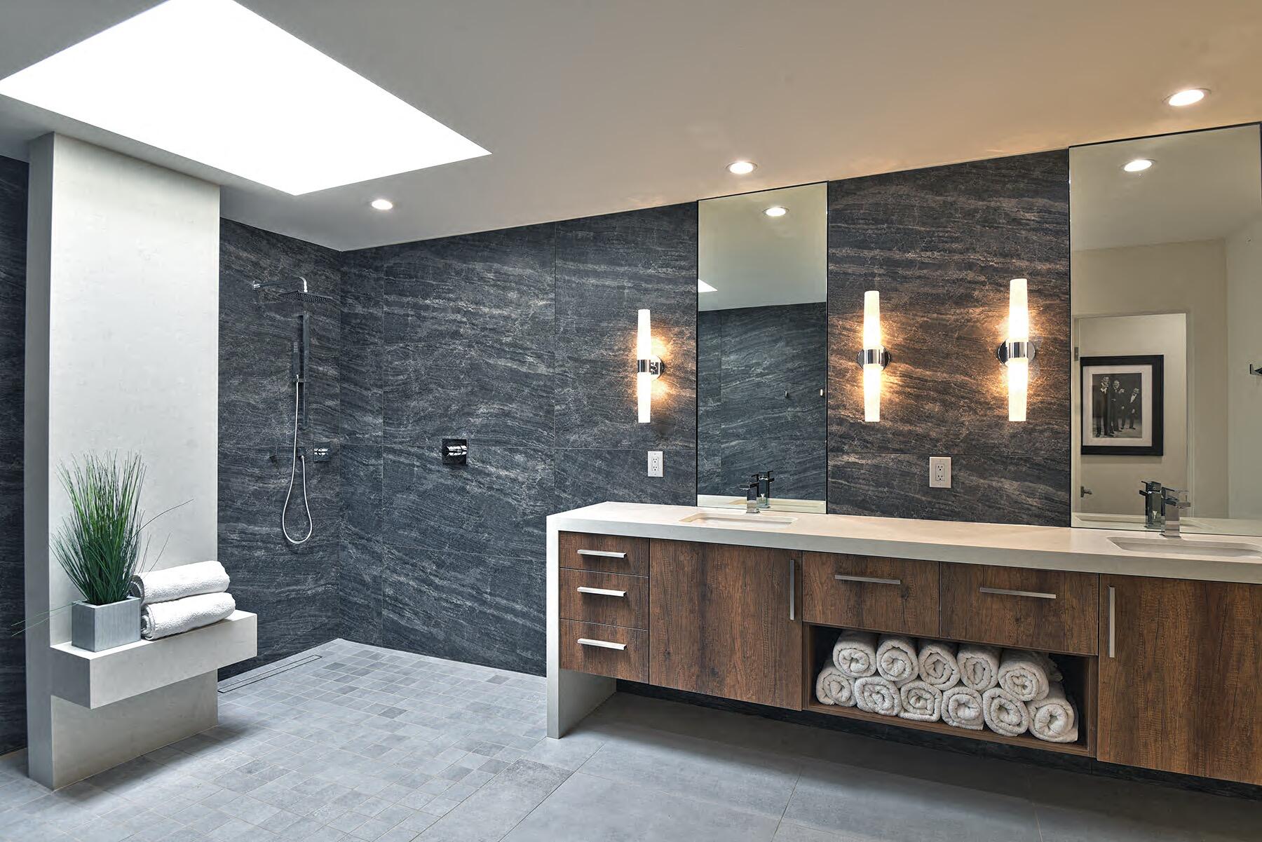 73 Princeton Drive Rancho Mirage, CA 92270 - Photo 5 of 44 a bathroom with a double vanity sink a mirror and a bathtub