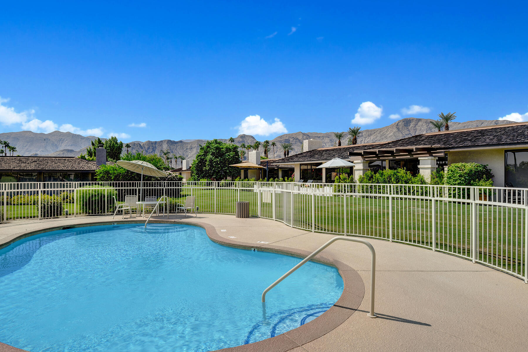 73 Princeton Drive Rancho Mirage, CA 92270 - Photo 42 of 44 a view of a swimming pool with a patio