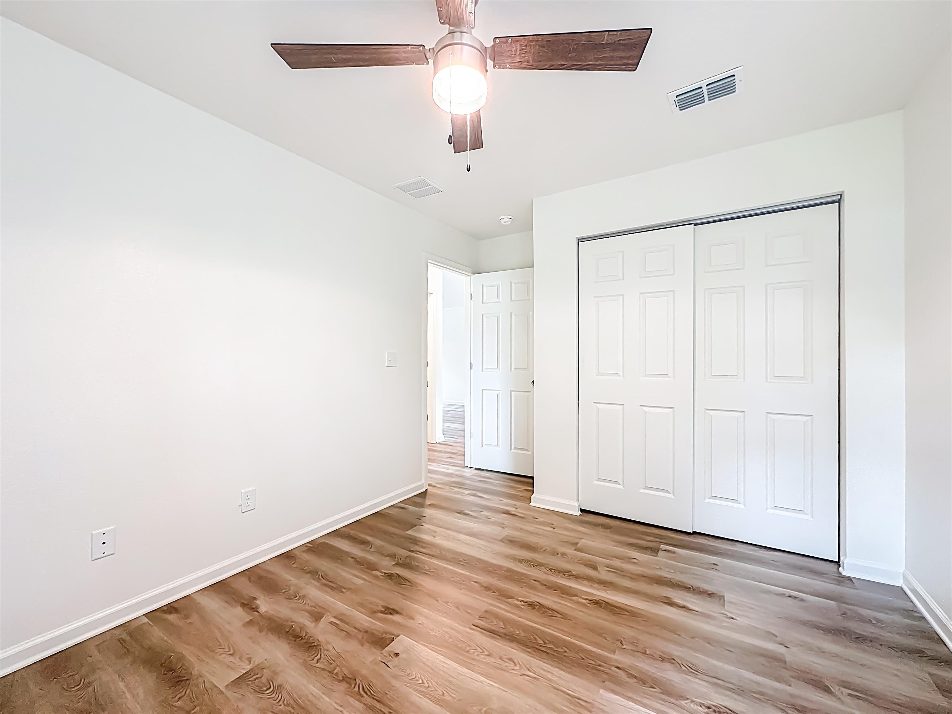 780 West 5th Street St. Augustine, FL 32084 - Photo 16 of 30 wooden floor in an empty room