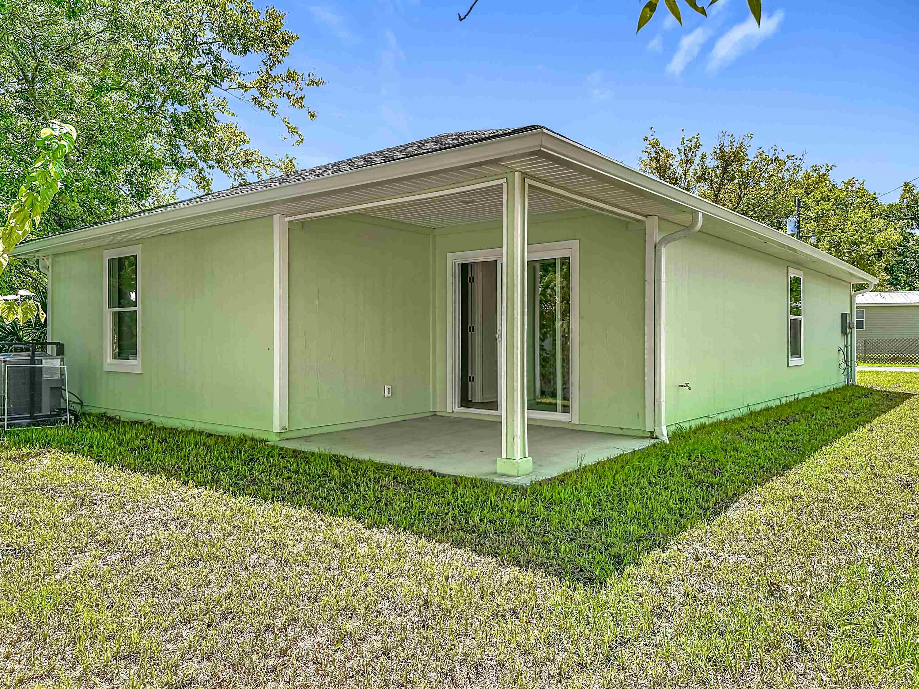 780 West 5th Street St. Augustine, FL 32084 - Photo 25 of 30 a front view of a house with a yard