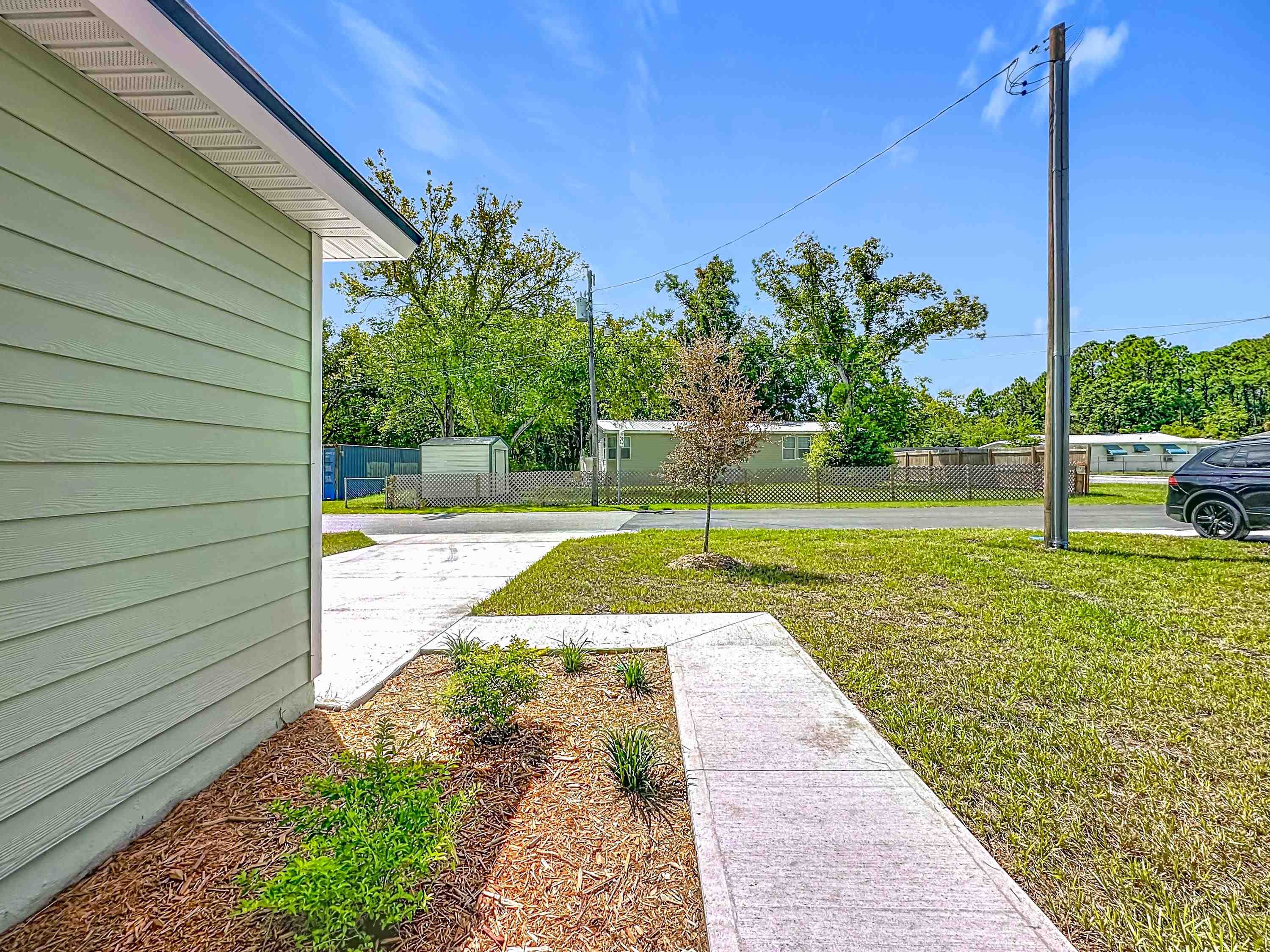 780 West 5th Street St. Augustine, FL 32084 - Photo 26 of 30 a view of a backyard with swimming pool