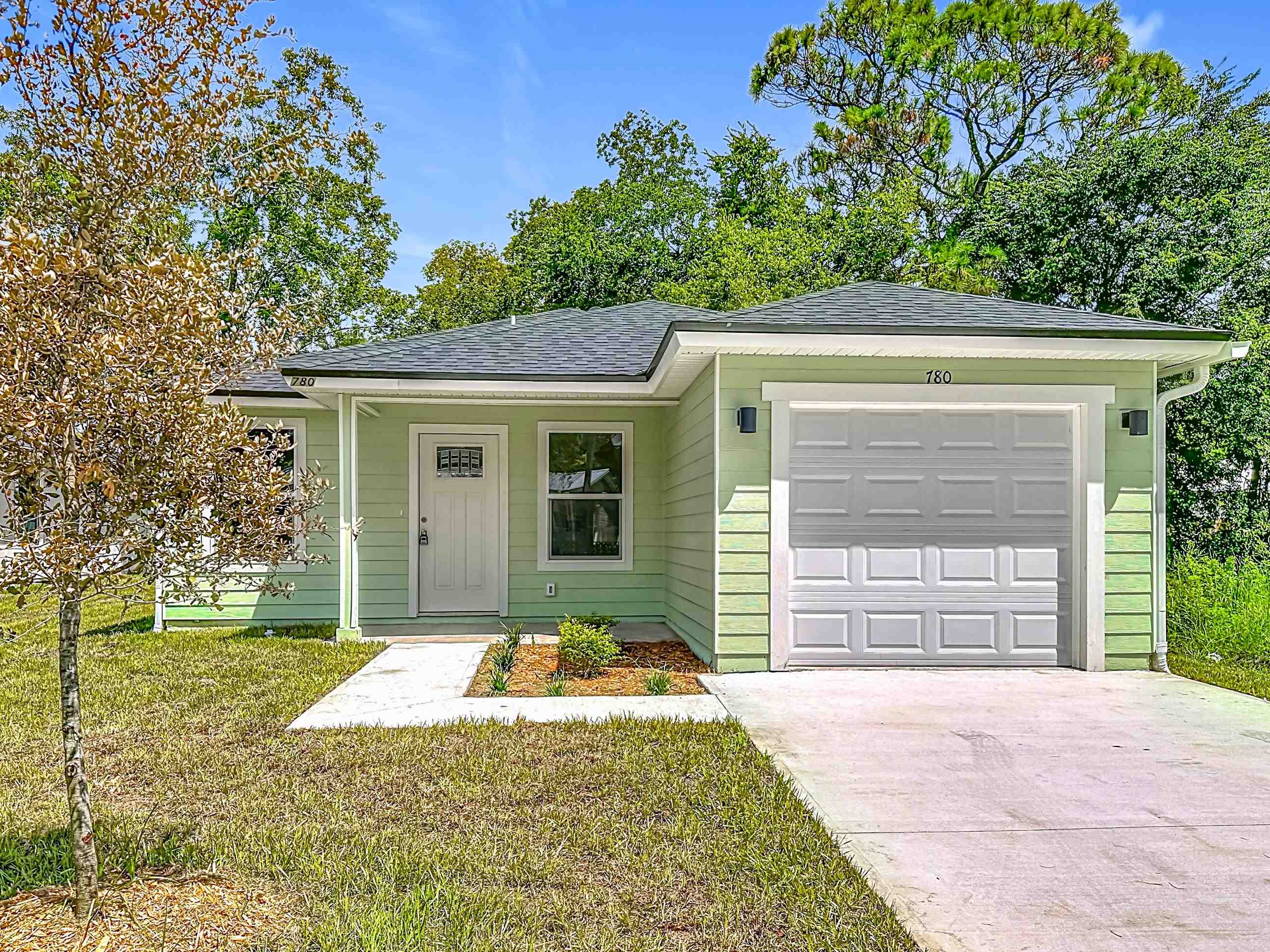 780 West 5th Street St. Augustine, FL 32084 - Photo 28 of 30 a front view of a house with a yard