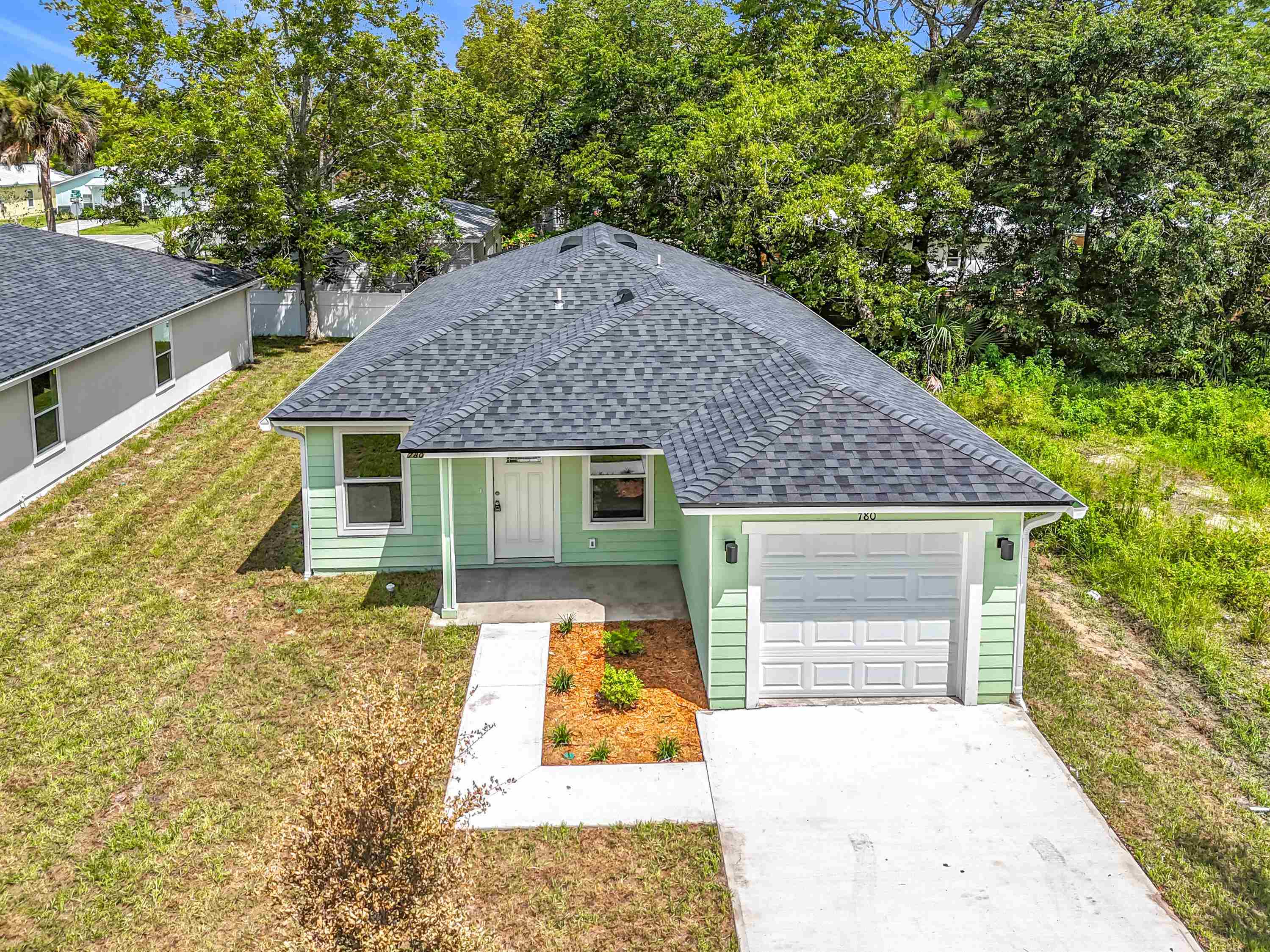 780 West 5th Street St. Augustine, FL 32084 - Photo 30 of 30 a front view of a house with yard