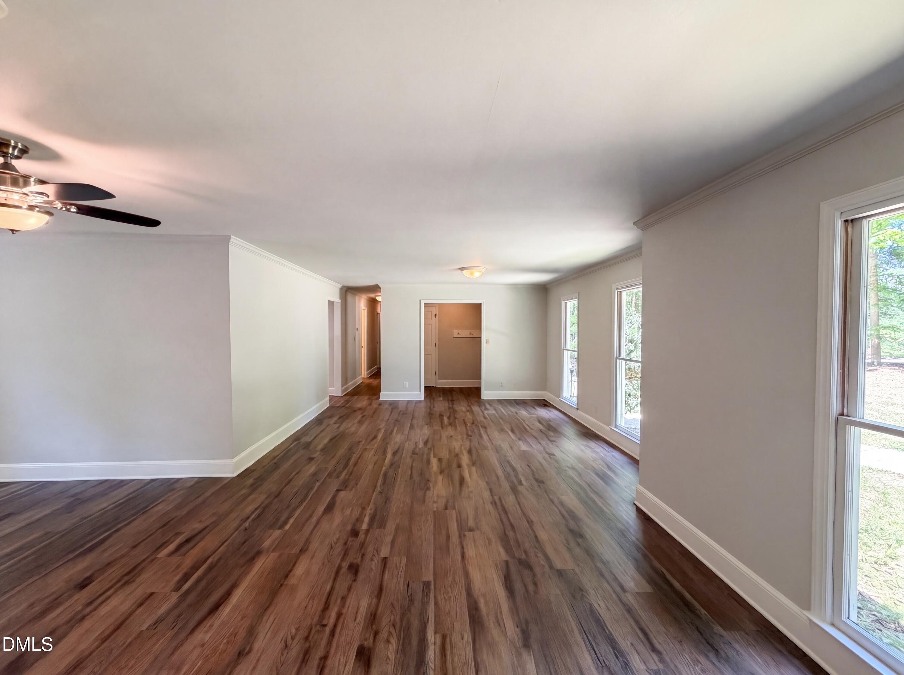 102 Lakeside Farm Road Zebulon, NC 27597 - Photo 6 of 18 a view of a room with wooden floor and window