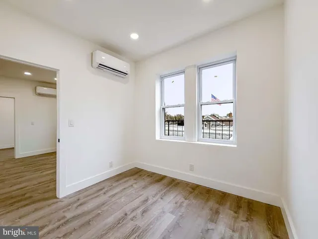 a kitchen with stainless steel appliances granite countertop a stove and a refrigerator