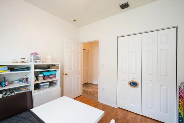 a kitchen with stainless steel appliances granite countertop a refrigerator and a stove
