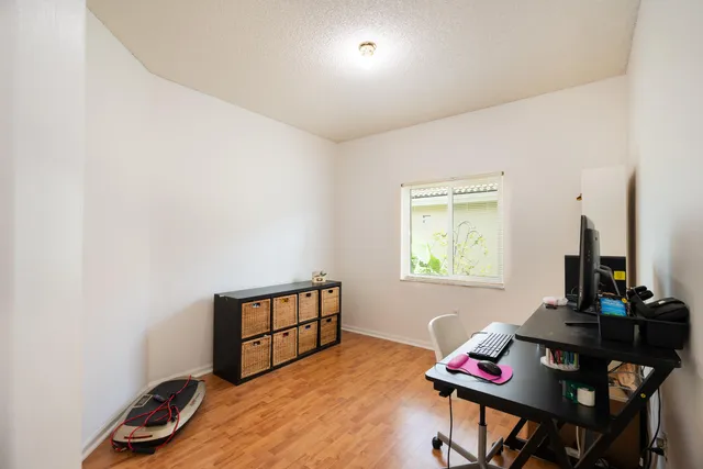 a bedroom with furniture and a window