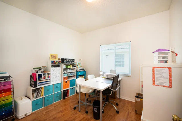 a view of a workspace with furniture