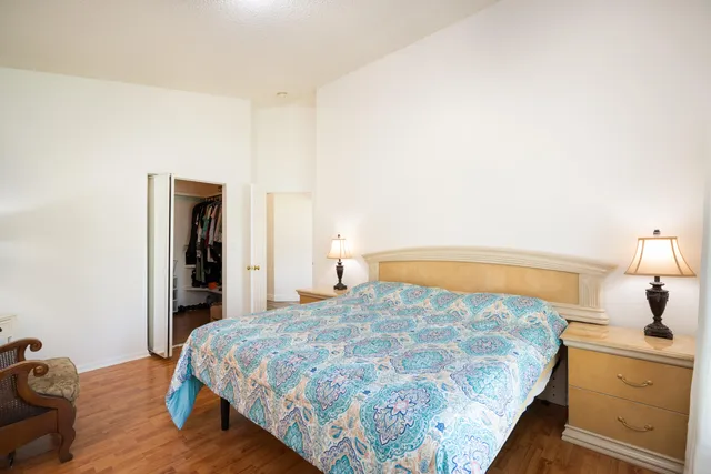 a bedroom with a bed and dresser