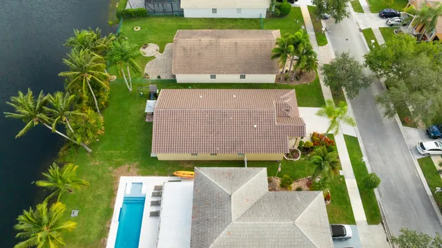 an aerial view of a house with a garden