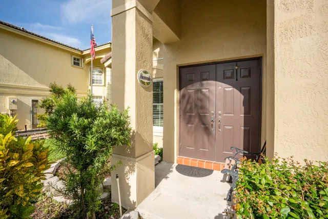 a front view of a house with a glass door