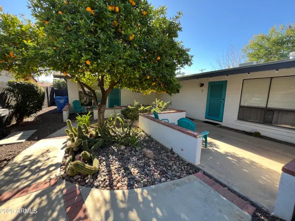 a house with lots of trees in the background