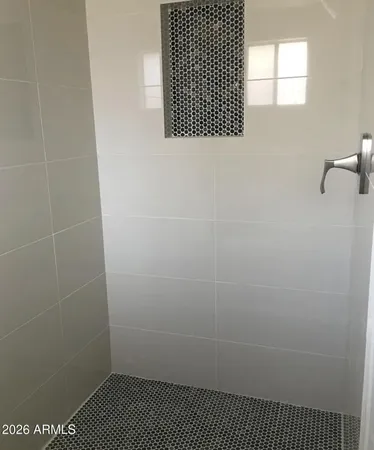 a bathroom with a bathtub sink vanity and a mirror