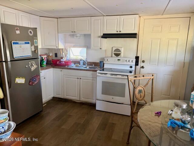126 Golf Course Lane Crescent City, FL 32112 - Photo 12 of 23 a kitchen with a sink cabinets and wooden floor