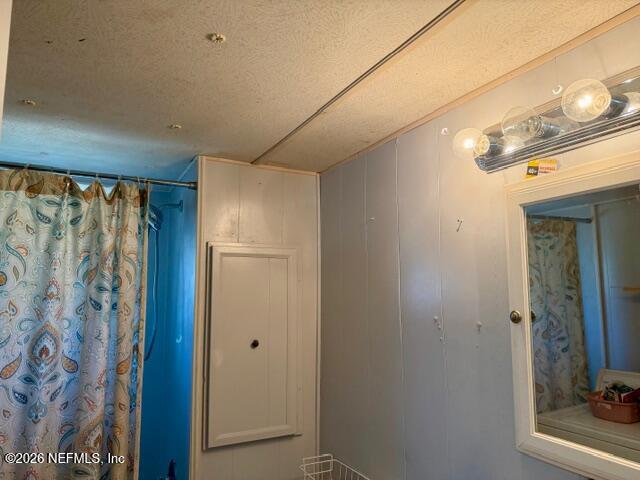 126 Golf Course Lane Crescent City, FL 32112 - Photo 16 of 23 a bathroom with a shower and a mirror